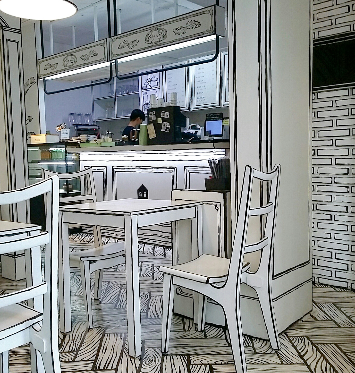 Unutar crno-bijelih kafića koji izgledaju poput 2D crtanih filmova 